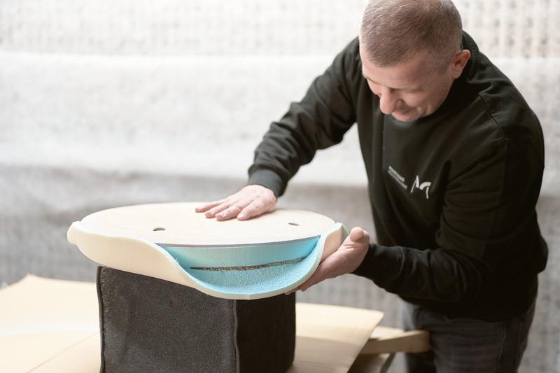 Foam being glued onto a seat shell