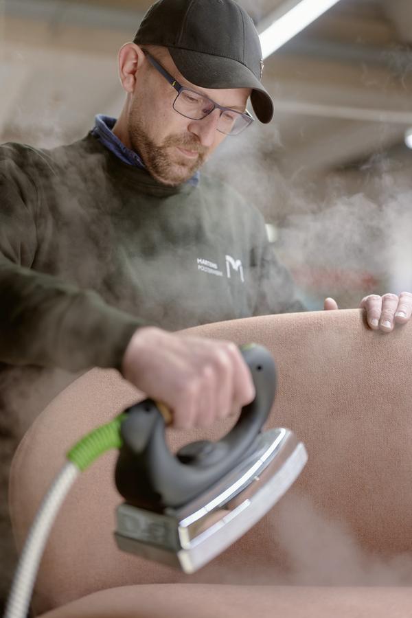 Cover being smoothed with steam